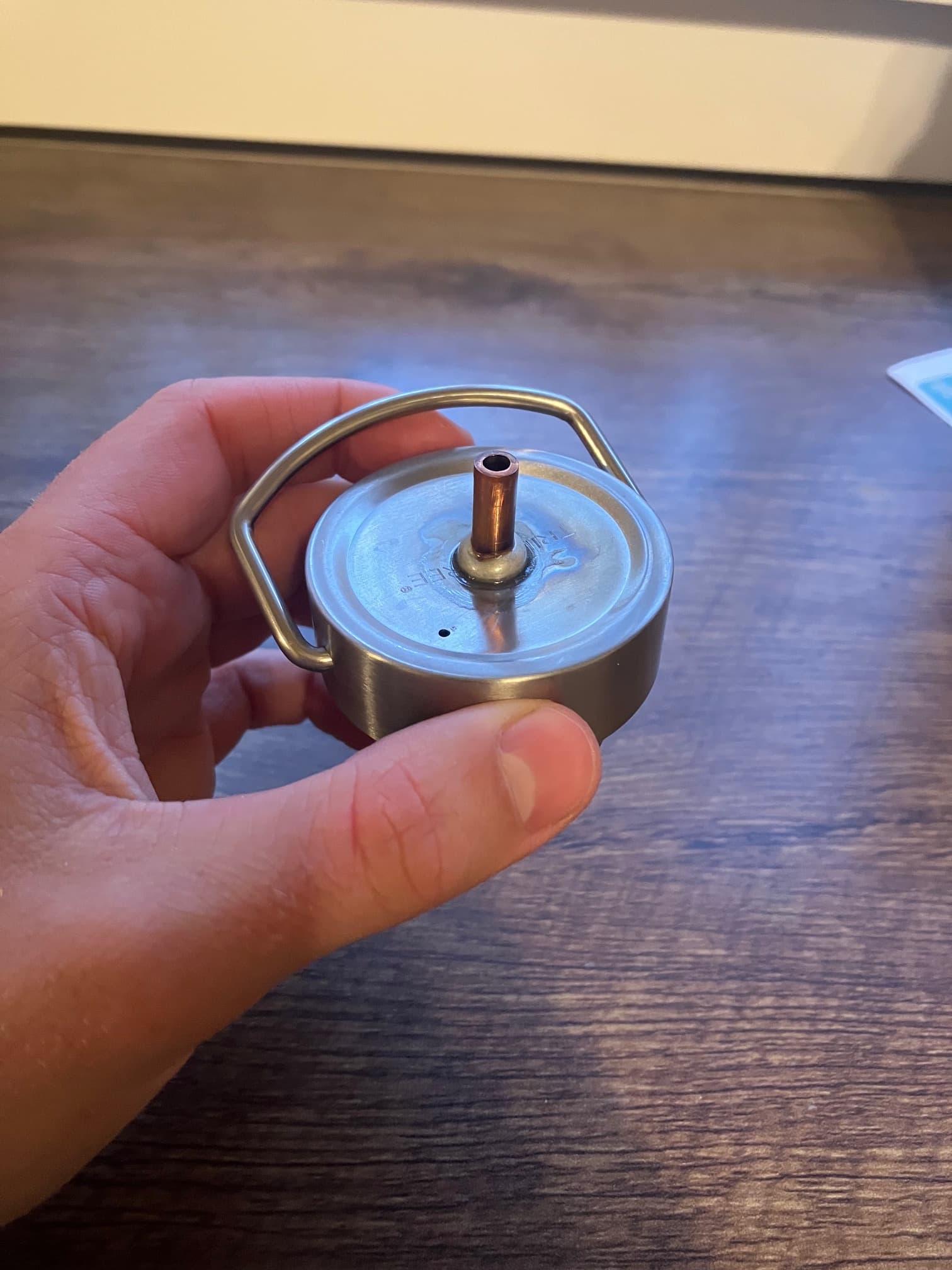 Modified stainless-steel bottle cap with sealed copper tubing