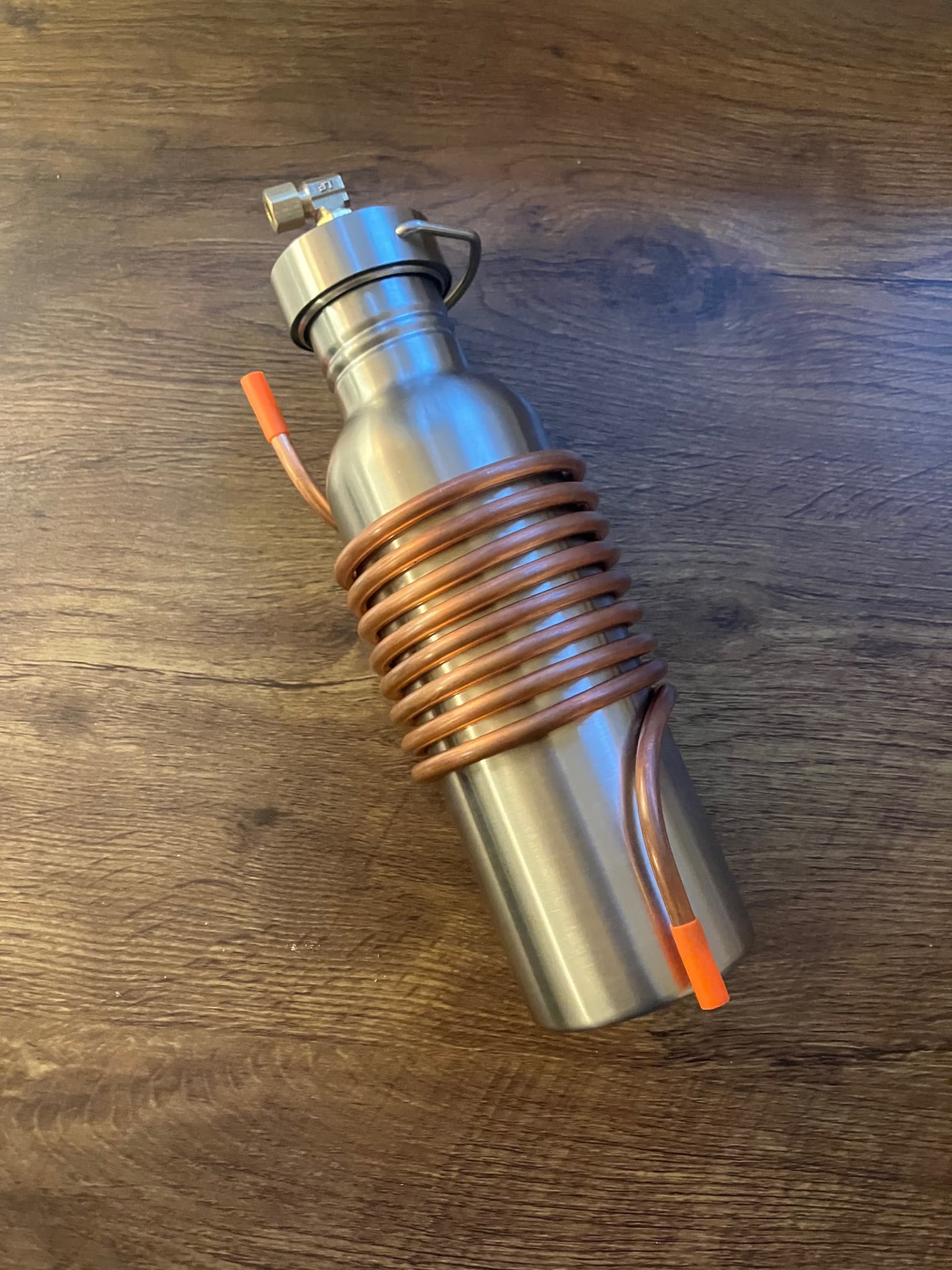 Compact copper condenser wrapped around the stainless-steel bottle